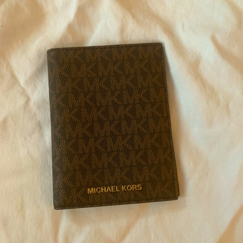 Michael Kors passport wallet.